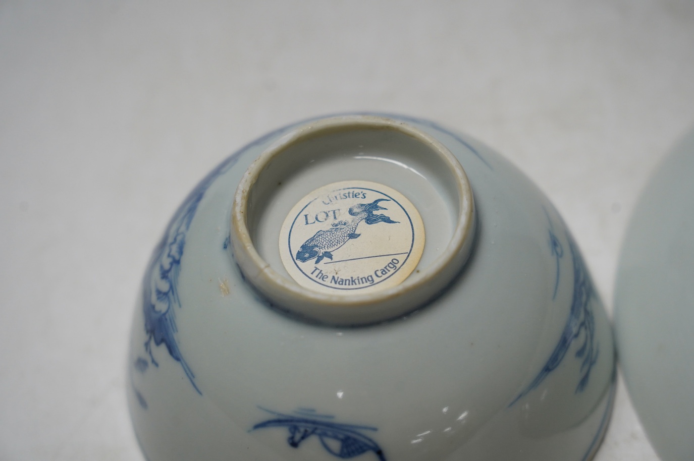 A large Chinese Nanking cargo blue and white tea bowl and saucer, saucer 17.5cm. Condition - good